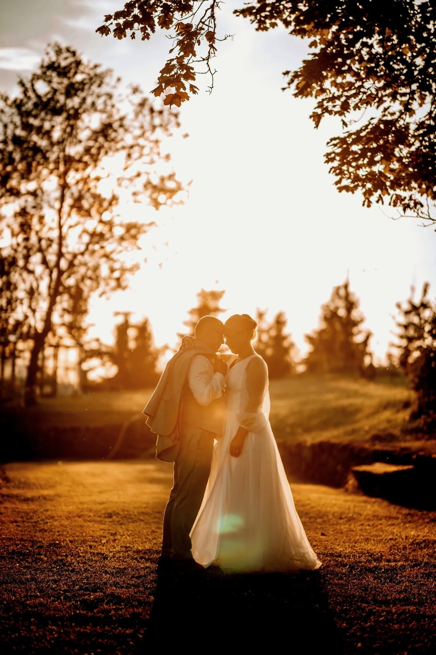 Wedding couple outdoor romantic portrait golden hour