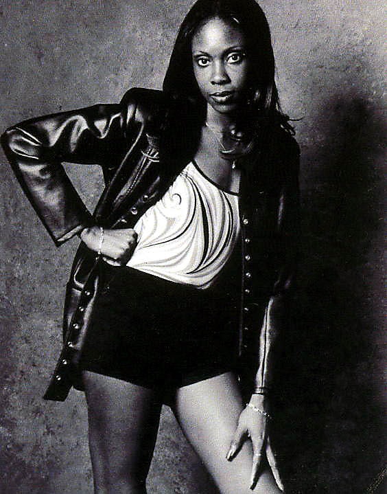Woman posing leather jacket shorts outfit